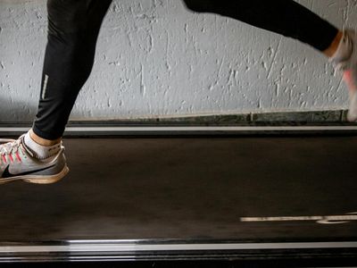 Running shoes neatly placed next to a gym bag